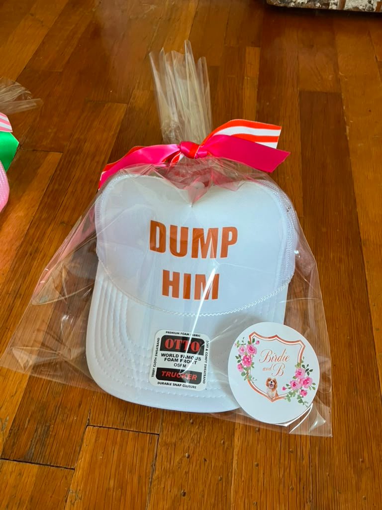 Ivory and orange Dump Him trucker hat